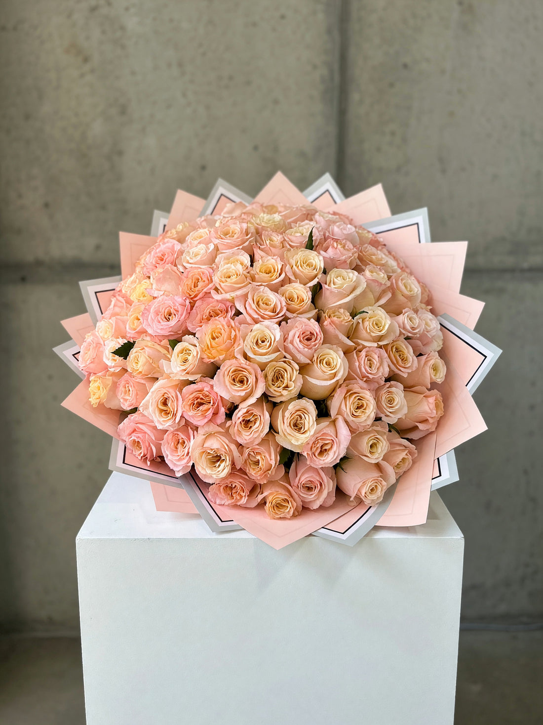 Georgia Peach Grand bouquet of 100 long-stem peach roses in decorative wrapping