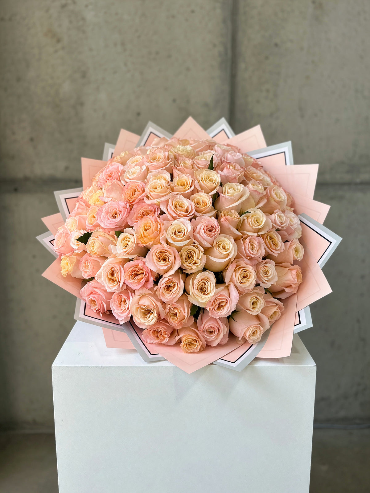 Georgia Peach Grand bouquet of 100 long-stem peach roses in decorative wrapping