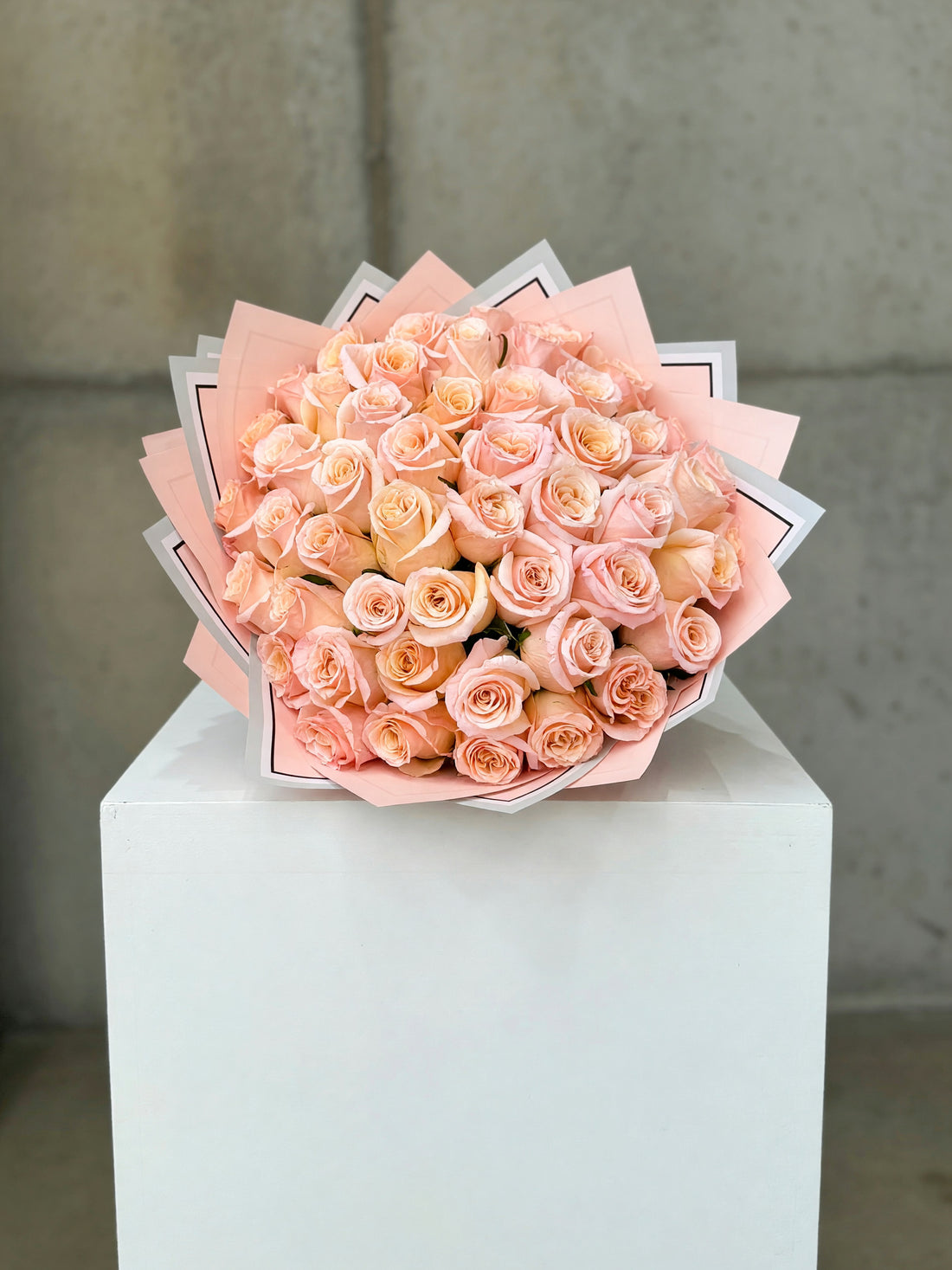 Georgia Peach Grand bouquet of 50 long-stem peach roses in decorative wrapping