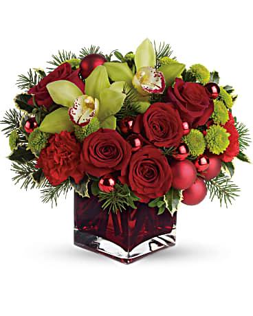 Merry and bright bouquet arranged in a red cube vase